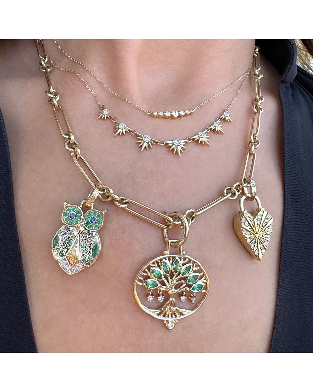Three Stories Love Owl Pendant styled with tree and heart pendants on layered gold chains