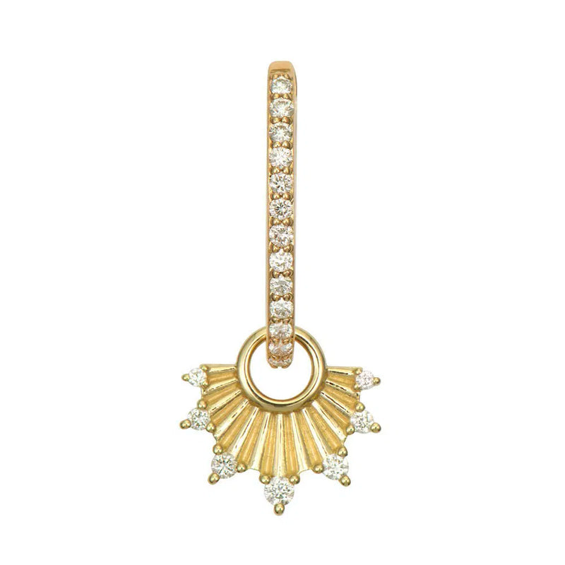 The Delicate Ruffled Fan Charm by Three Stories Jewelry is a 14K yellow gold hoop earring adorned with small diamonds, featuring a fan-shaped charm with radiating lines and diamond accents, resembling a stylized sunburst.