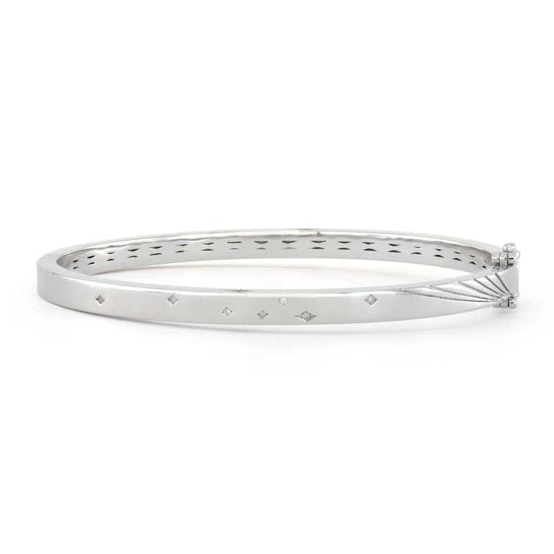 Adorn your wrist with the Mixed Metal Plain Diamond Bangle by Three Stories Jewelry. This sterling silver bracelet has diamond-shaped engravings, cutout designs with multi-colored tourmalines, and a secure hinge clasp for graceful elegance.