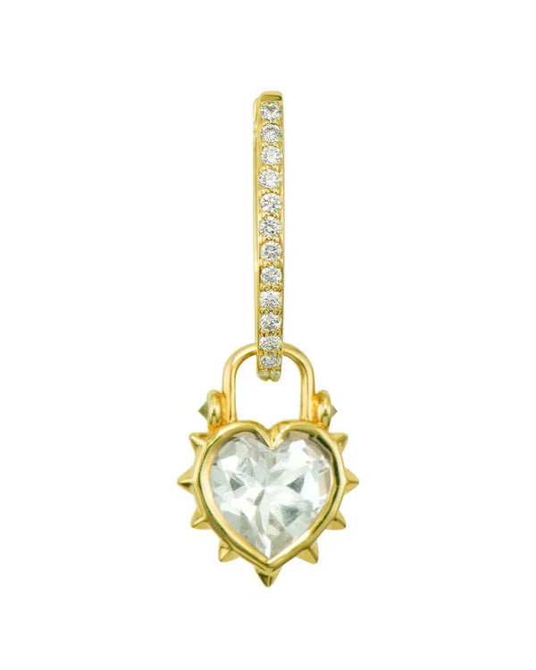 The Thorned Jewel Heart Charm by Three Stories Jewelry features a 14K yellow gold hoop with a row of small diamonds and a heart-shaped clear gemstone pendant with a spiked gold border, perfect for pairing with bold statement or paperclip chains.