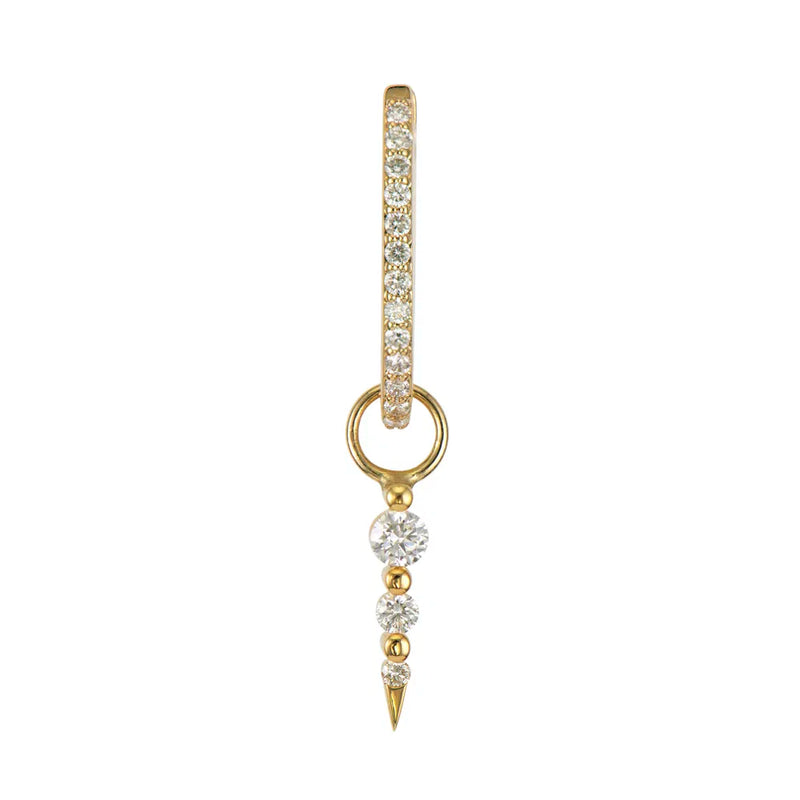 The Medium Sari Dagger Charm by Three Stories Jewelry is a vintage-inspired gold hoop earring with small clear gemstones and features three descending round diamond charms, all set in radiant 14K yellow gold, ending with a pointed gold tip.
