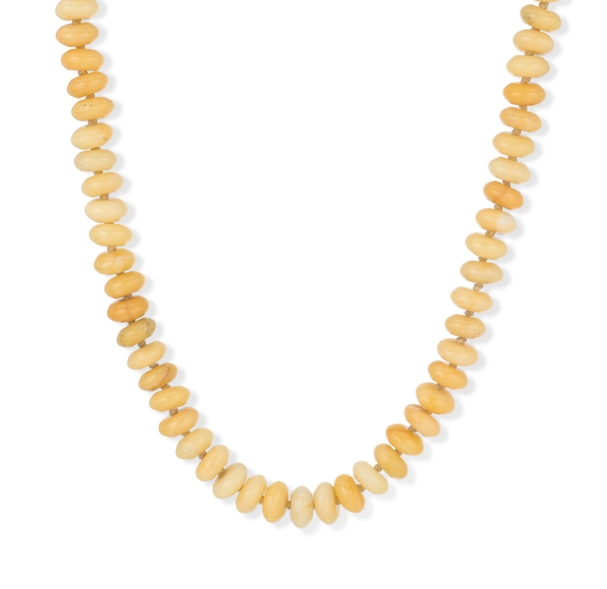 A close-up of the Adina Reyter Yellow Jade Gemstone Necklace, featuring rounded, disc-shaped yellow and light brown beads arranged in a graduated pattern on a white background.