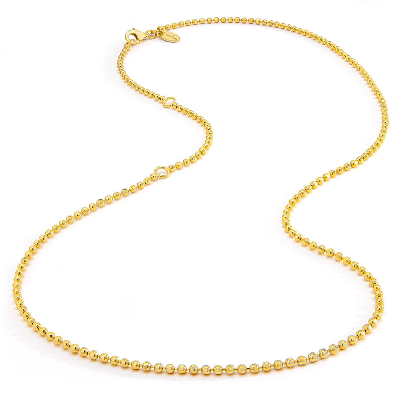 An elegant Aaron Basha Vermeil Faceted Ball Chain necklace with 18K gold plating is gracefully laid on a plain white background, showcasing its consistently rounded beads that exude personal empowerment.