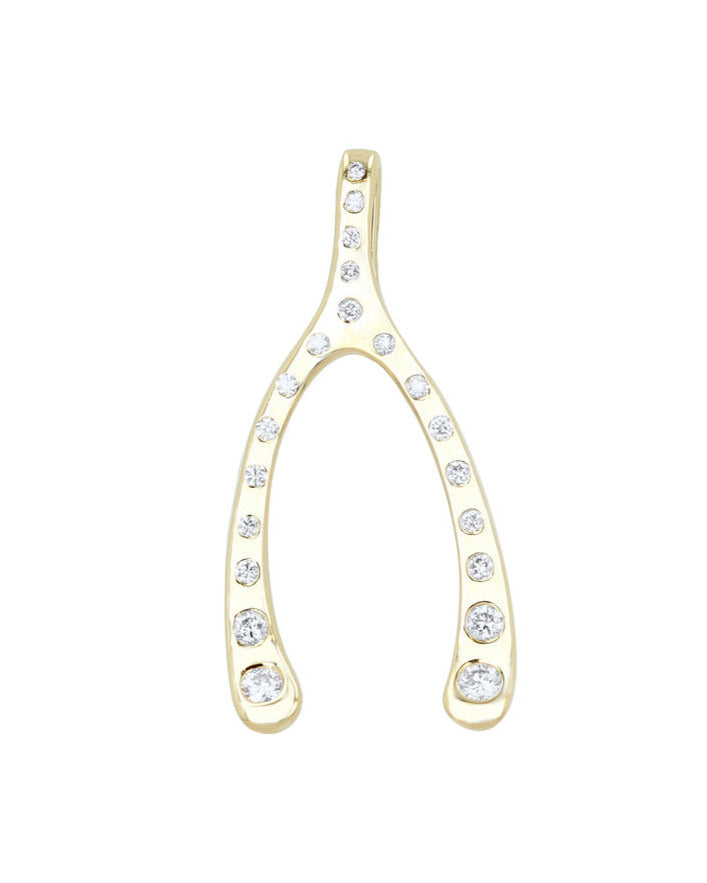 The Diamond Wishbone Charm by Rachel Reid is a 14k gold pendant shaped like a wishbone, symmetrically adorned with small, clear gemstones. Its simple and elegant design highlights the metals shine and mimics the sparkle of a diamond pave necklace.