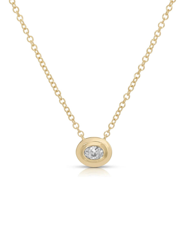 The ef collection Oval Diamond Necklace features a delicate gold chain and an oval-shaped pendant with an ethically sourced diamond in a gold bezel, shown against a white background.