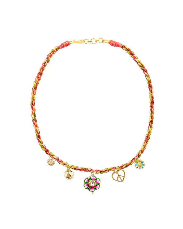 The Monoki Grigri Choker - Flower features pink, green, and gold braided threads with five gold-plated pendants—a flower, heart, star, and two round charms. This adjustable choker ensures a perfect fit.