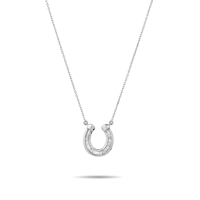 The Baguette Horseshoe Necklace by Adina Reyter is a 14k silver piece with a delicate chain and a horseshoe pendant featuring embedded small, clear gemstones, all isolated on a white background.