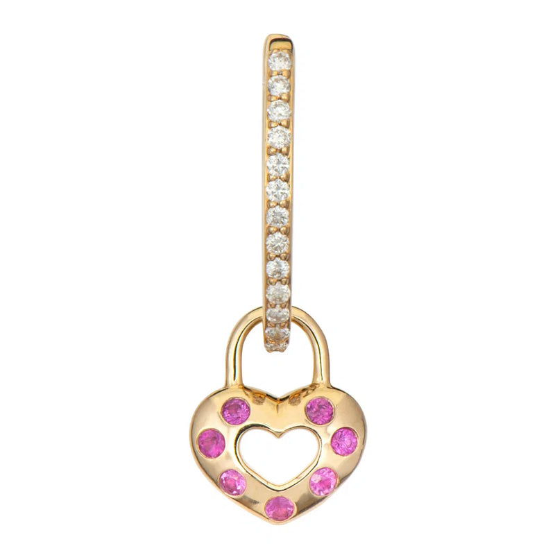 The Open Love Explosion Double-Sided Heart Charm by Three Stories Jewelry is a heart-shaped gold pendant resembling a padlock, adorned with pink gemstones and a smaller heart cutout. It hangs from a gold hoop encrusted with tiny white stones and rainbow sapphires, offering vibrant colors and charm.