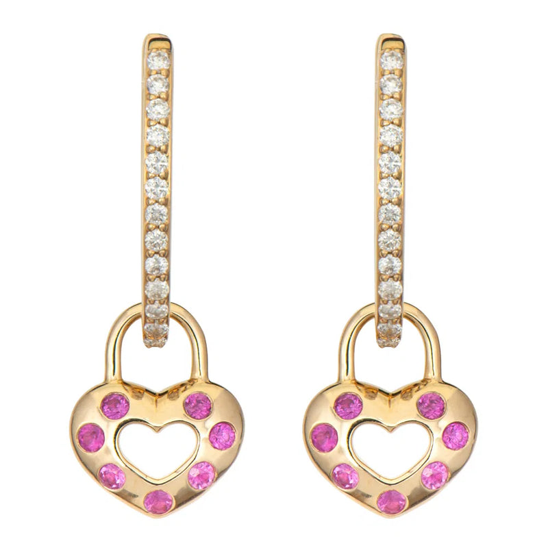 Two Open Love Explosion Double-Sided Heart Charm earrings by Three Stories Jewelry feature gold heart-shaped pendants with pink gemstones and rainbow sapphires. The hoops are adorned with small white stones for added sparkle.