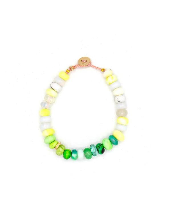 The Scosha Candy Gem Bracelet in Cactus, with alternating white, yellow, and green round beads and a small circular clasp, is showcased on a white background.