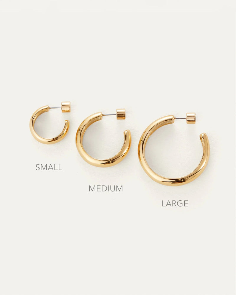 The Jenny Bird Staple Hoop Earrings - Medium are shown with small and large sizes on a white background, each labeled. These 14k gold-plated, lightweight hoops offer versatile style for any occasion.