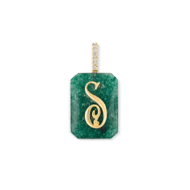 The Small Emerald Cut Cabochon Monogram Charm by Kate Collins Jewelry is a green gemstone pendant with a gold ornate S, featuring a textured surface. A gold bail, adorned with small diamond-like accents, adds to the personalized elegance.