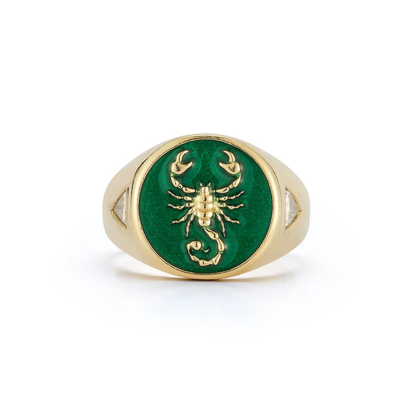 The Fearless Signet Ring by Kate Collins Jewelry features a 14K gold band with a striking scorpion on an emerald green enamel, tapering gently to enhance its intricate design.