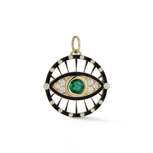 The Protection Charm by Kate Collins Jewelry is a captivating circular pendant featuring an eye-like design with a central green gemstone, encircled by small diamonds. It has black sections with diamond accents and is crafted in 14 Karat Yellow Gold.