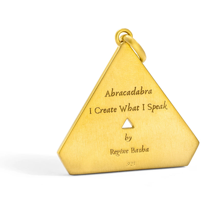 Discover the Large Abracadabra Triangle Series 5 necklace by Aaron Basha, featuring a triangular pendant inscribed with Abracadabra I Create What I Speak. This piece is crafted with exquisite detail in 18K gold plating, embodying personal empowerment and style.