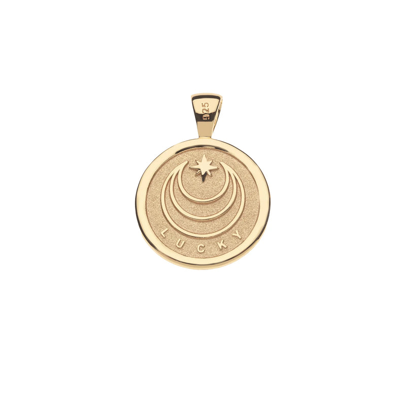 The LUCKY Rabbit JW Small Embellished Pendant Coin by Jane Win is a gold circular pendant with LUCKY engraved, stylized crescent moons, a star above, and a charming top loop marked 925, indicating sterling silver quality.