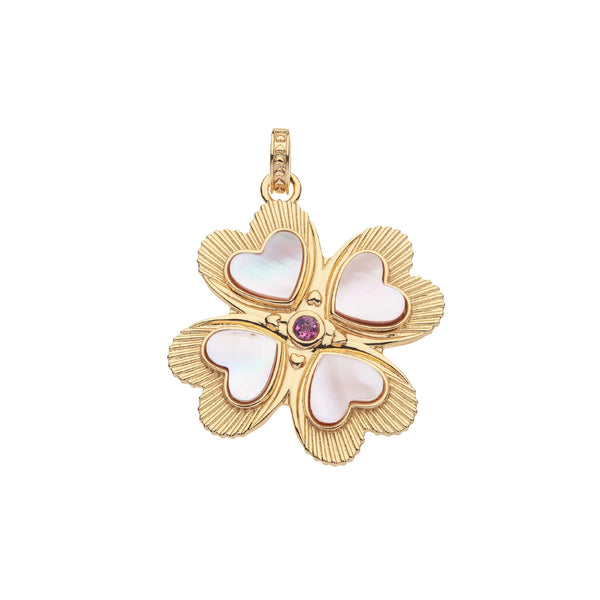 The Lucky in Love Clover Pendant by Jane Win is a gold-plated sterling silver love pendant featuring heart-shaped white stone inlays and a central pink tourmaline gem. It has subtly textured edges and a loop on top for chain attachment.