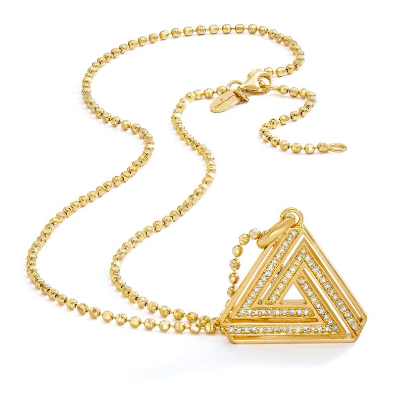 The Small Abracadabra Triangle Series 4 by Aaron Basha is a gold chain necklace with a triangular pendant, exuding personal empowerment with interconnected gem-encrusted frames. It highlights inner strength and features a lobster claw clasp.