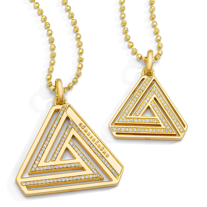 Aaron Bashas Small Abracadabra Triangle Series 4 features two gold triangular pendants with intricate, layered designs and sparkling stones on beaded chains, symbolizing empowerment and inner strength.