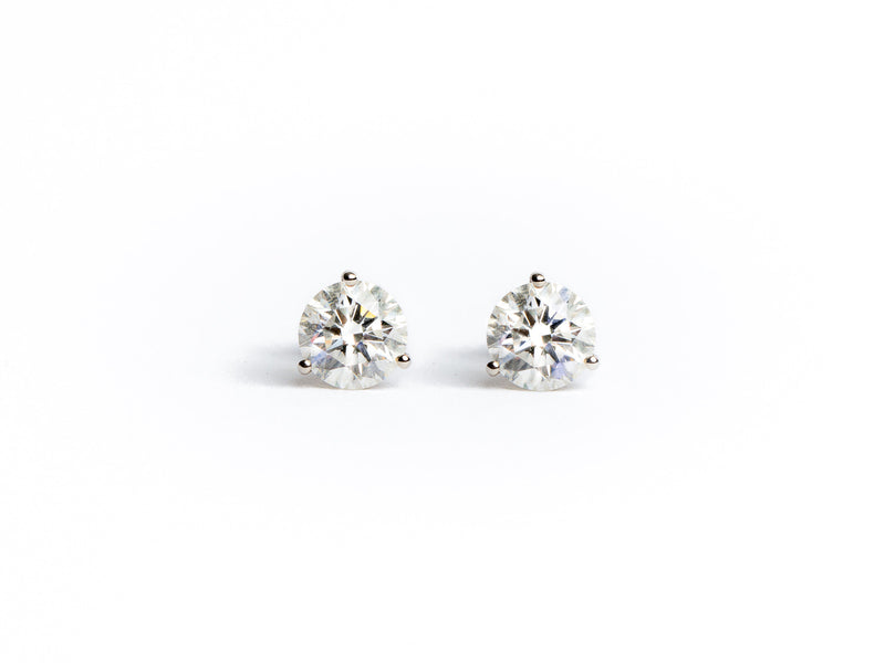 Lab Grown Studs by Monarch Market are diamond stud earrings with a round cut design set in a minimalist metal display against a plain white background.