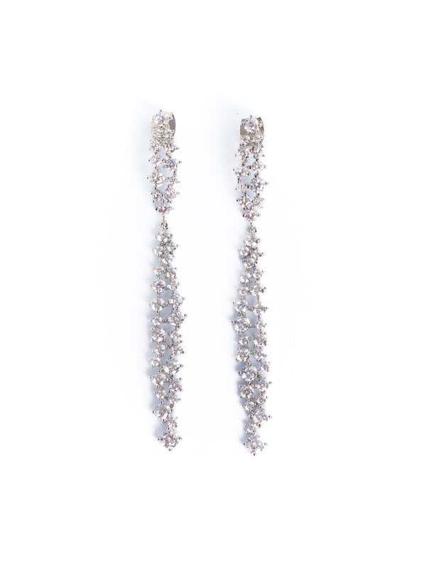 A pair of earrings with a central diamond-like stone surrounded by smaller clear crystals, set in white gold or platinum mountings.