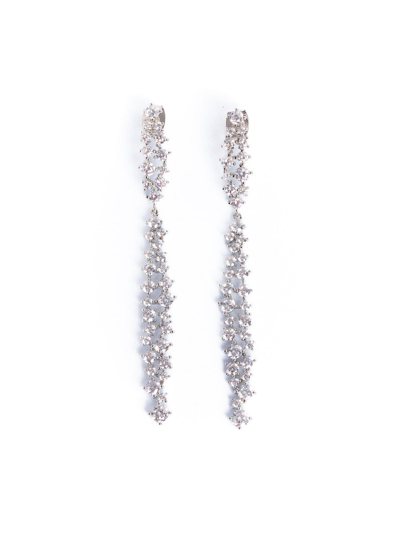 A pair of earrings with a central diamond-like stone surrounded by smaller clear crystals, set in white gold or platinum mountings.