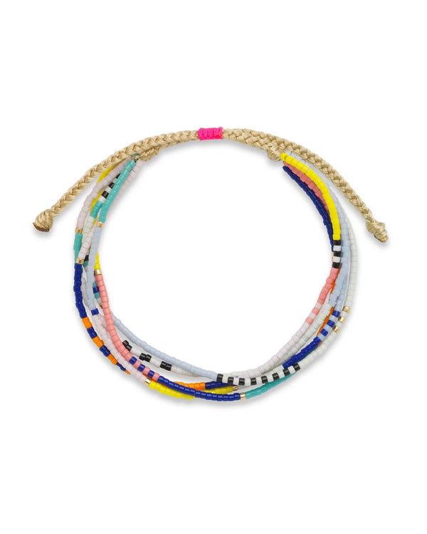 The Trinity Beaded Bracelet by Oiya features multicolored Miyuki beads—blue, pink, yellow, white, black, and green—on a braided tan cord with a small pink accent for a vibrant and distinctive look.