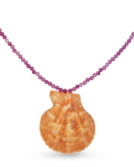 The Oiya Sandy Seashell Beaded Necklace features handmade turquoise and purple beads with a bold orange-brown seashell pendant, shown elegantly on a white background.