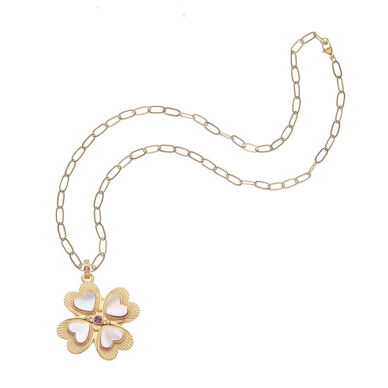 Jane Wins Lucky in Love Clover Pendant features a gold-plated sterling silver chain with four mother-of-pearl heart-shaped leaves encircling a central pink tourmaline, embodying exquisite elegance.