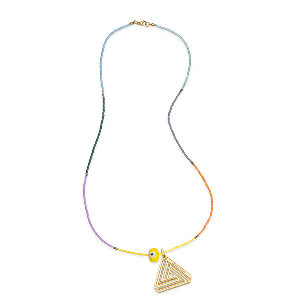 The Delilah Eye Necklace by Aaron Basha is a pastel beaded necklace with a triangular pendant, a small yellow bead, and features a vermeil clasp. It showcases a gradient of colors from blue to orange.