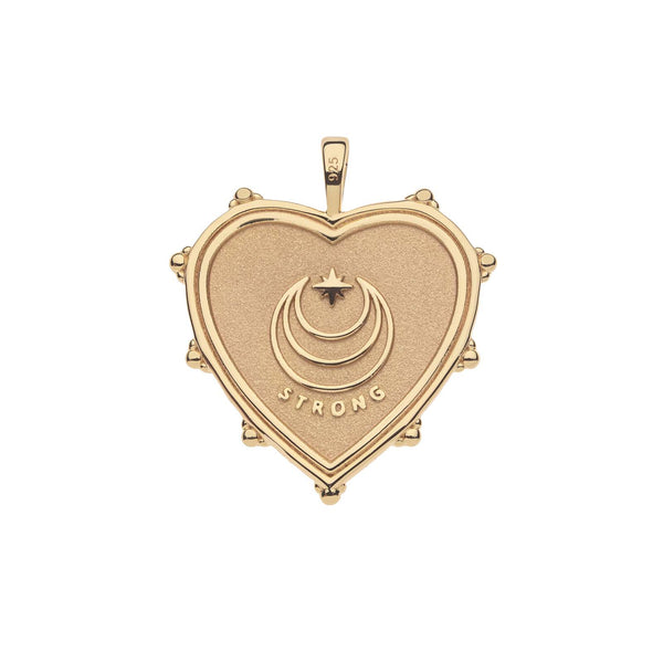 The Jane Win STRONG JW Heart Pendant is a 14k gold-plated sterling piece, with a heart shape featuring a crescent moon and star design. STRONG is engraved below the center, and decorative bumps adorn the edges, symbolizing resilience and grace.