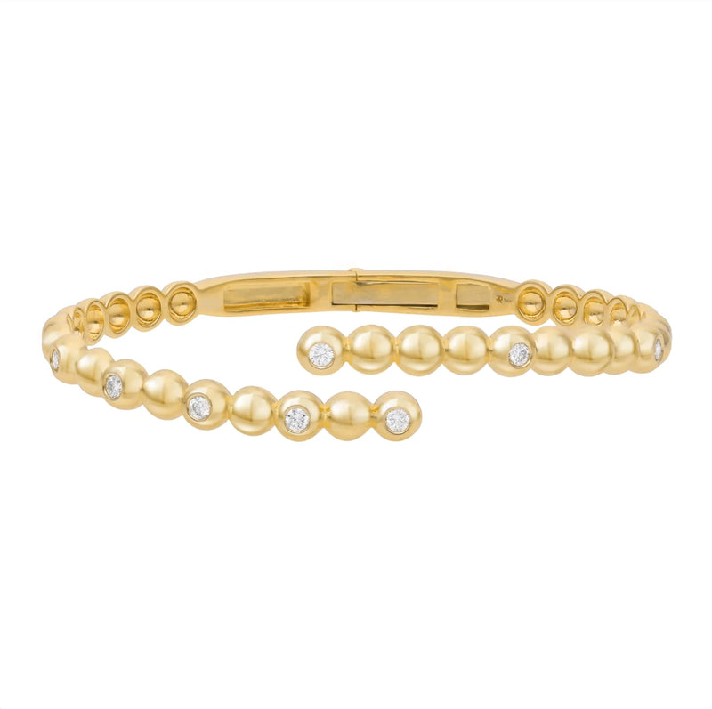 Presenting the Rachel Reid Diamond Bubble Bypass Bangle, a breathtaking bracelet crafted in 14k yellow gold. This sophisticated piece features a graceful, curved design embellished with small, round gems totaling 0.40 CT in weight, thoughtfully arranged for an ageless allure.