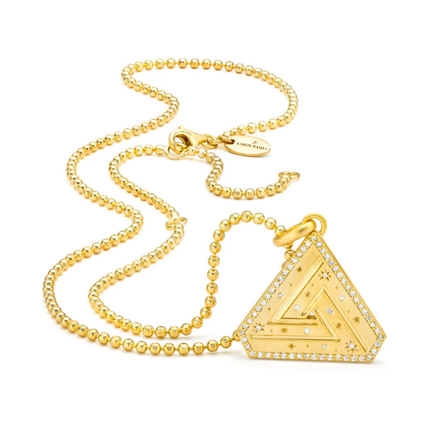 The Vermeil Faceted Ball Chain by Aaron Basha showcases a gold beaded chain with 18K gold plating. Its triangular pendant features star engravings and small embedded diamonds, exuding personal empowerment. Displayed on a white background, it includes a branded tag near the clasp.