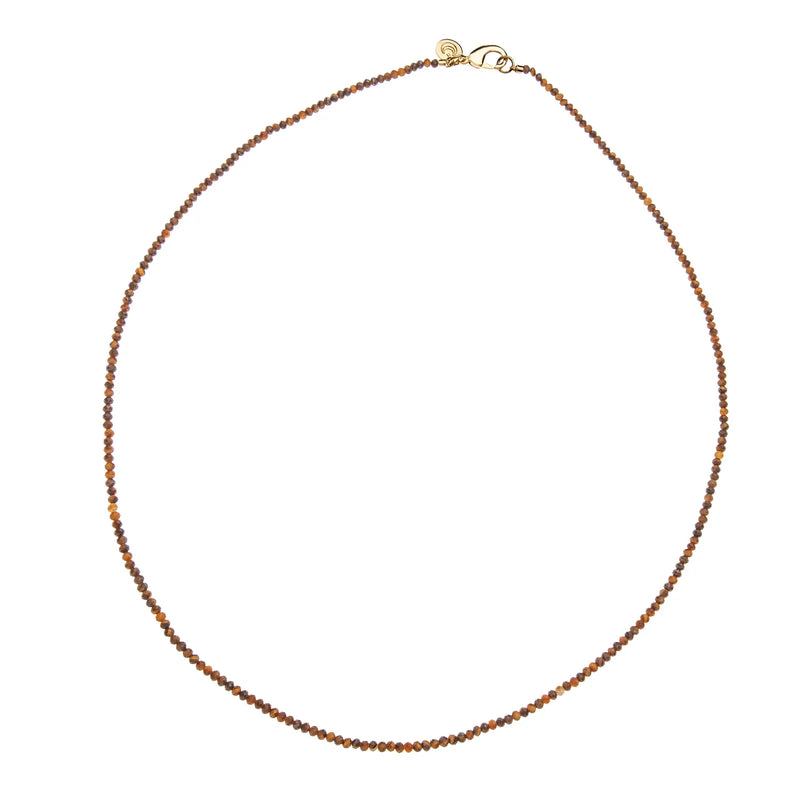 The Jane Win Double Wrap Diamond Cut Beaded Necklace in Tiger's Eye features small, round brown beads and a gold plated clasp, beautifully arranged in a circle on a white background.