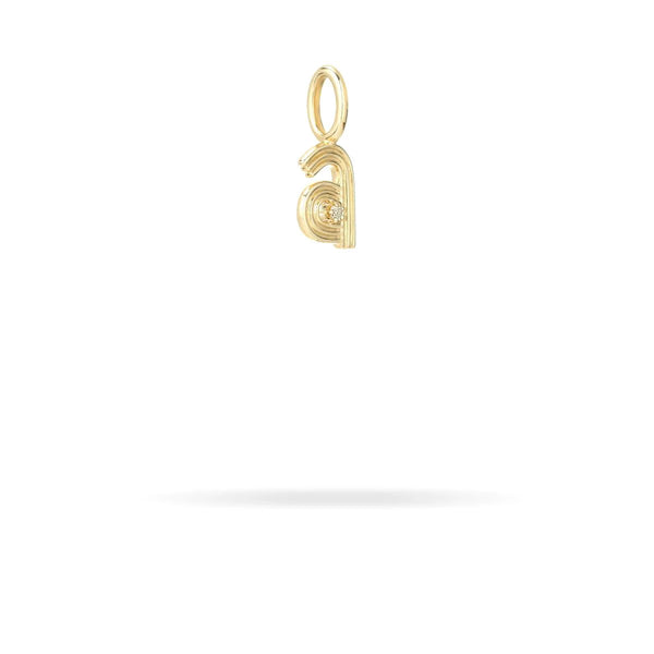 A gold pendant crafted in 9K yellow gold, featuring a lowercase "a" design with a small circle at the center, is suspended against a white background. This elegant piece from Adina Reyter's Groovy Diamond Initial Mini Bead Charm collection beautifully incorporates the mini bead charm for added sophistication.