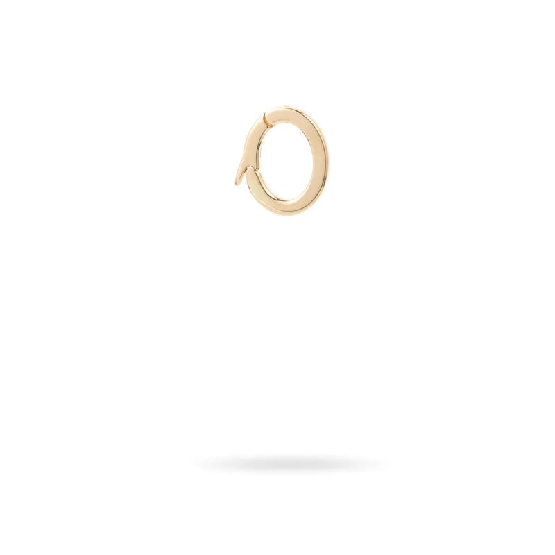 The Oval Charm Clip by Adina Reyter, a small gold hoop earring made of 14k yellow gold with pavé diamonds and a seamless closure, is displayed on a plain white background, casting a faint shadow.