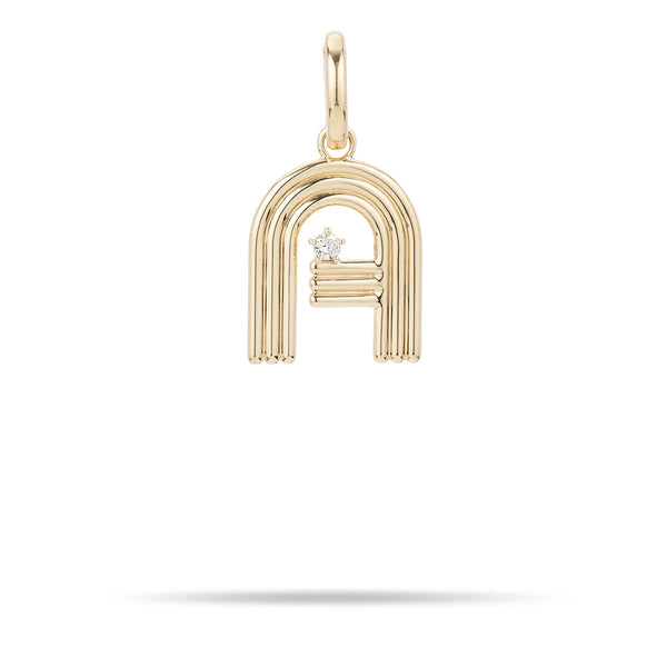 The Groovy Diamond Initial Charm by Adina Reyter, crafted from 14k yellow gold, is elegantly designed in the shape of an "A" with a diamond charm embedded on the inner bar. It hangs gracefully from a loop and features rounded edges along with a smooth finish. The pendant is beautifully isolated on a white background.