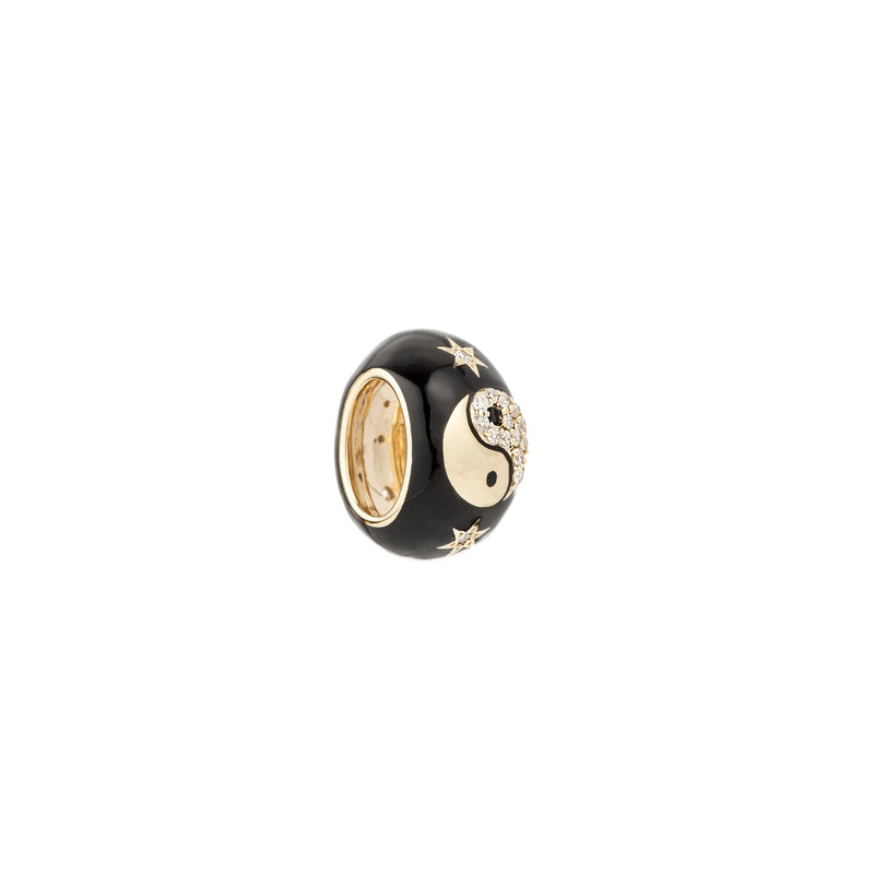 The Zodiac Ceramic + Diamond Gemini Big Bead by Adina Reyter features black ceramic, gold star accents, and a diamond-encrusted yin-yang detail, offering celestial elegance to your zodiac jewelry. Photographed on a white background.