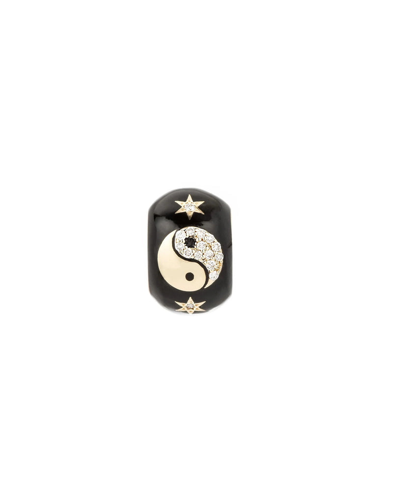The Adina Reyter Zodiac Ceramic + Diamond Gemini Big Bead is a black ring with a gold and pavé diamond yin-yang charm at the center, accented by small gold stars above and below, shown on a plain white background.