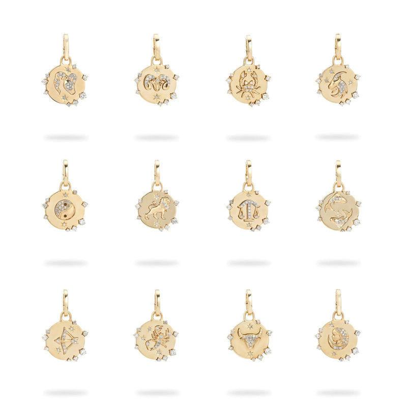 Twelve Adina Reyter Zodiac Diamond Hinged Charms in 14k yellow gold, each round with edge-set diamonds and a unique engraved zodiac symbol at the center, are displayed in three rows on a white background.
