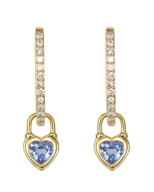 Gold hoop earrings by Three Stories Jewelry, featuring Beating Heart Medium Blue Sapphire Charms in 14K Yellow Gold with clear crystals and dangling gold heart-shaped charms with blue sapphire centers—from the Stories of Love Collection.