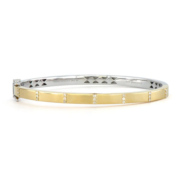 Experience elegance with the Mixed Metal Plain Diamond Bangle by Three Stories Jewelry. This sterling silver piece has a gold exterior adorned with diamond clusters and features multi-colored tourmalines for flair. Its hinge closure ensures a perfect fit.