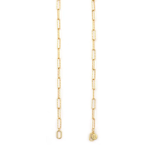 The Open Diamond Cut Paperclip Chain 18 by Three Stories Jewelry features rectangular links with a small oval clasp and a charm engraved with C, displayed against a white background.