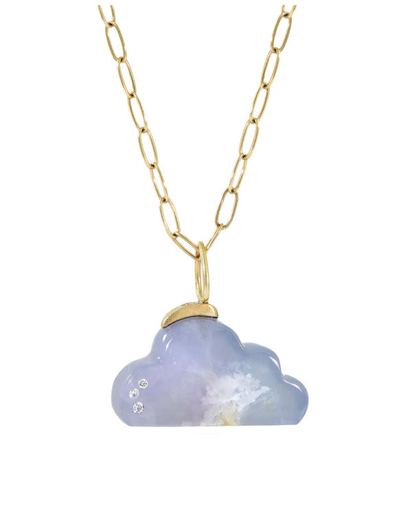 The Karen Luvaas Blue Calcedony Cloud Charm features a gold chain necklace with a cloud-shaped blue chalcedony pendant, accented by three small inset diamonds on the left side.