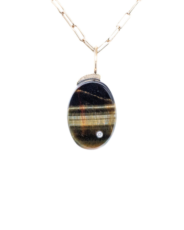 Blue Tiger Oval Charm by Karen Luvaas: an oval pendant with a multicolored striped stone set in gold, accented with a small diamond and hanging from a delicate elongated-link gold chain, shown on a white background.