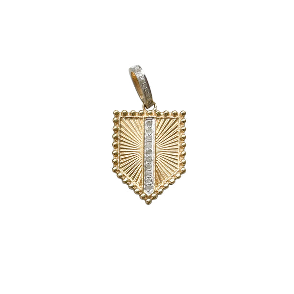 The Woods small gold pentagon pendant features a sunburst pattern with a vertical silver stripe adorned with glittering stones, enhanced by a ribbed texture and includes a pave diamond bail for easy attachment.