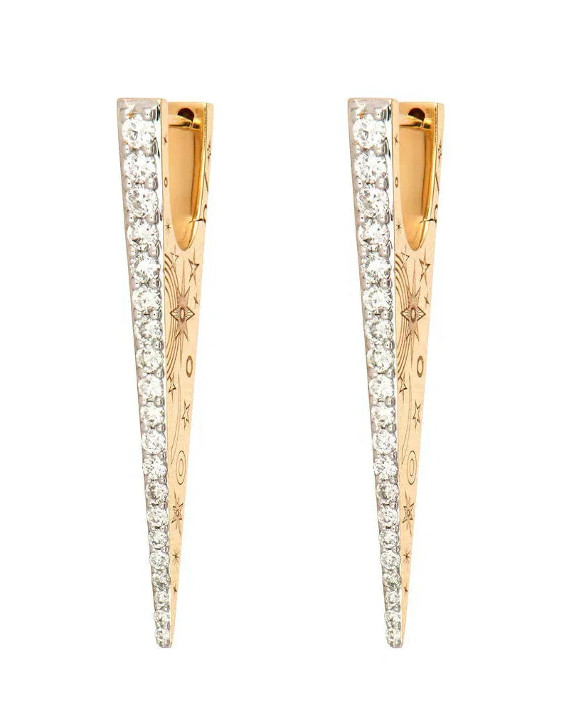 The Elongated Diamond "V" Hoop Earrings by Three Stories Jewelry feature 14K yellow gold, pave diamond-encrusted edges, and engraved star and eye designs on the flat surfaces.