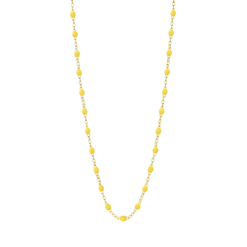 The Classic Gigi 17 Necklace by Gigi Clozeau features evenly spaced, hand-lacquered resin beads on a delicate 18k gold chain, shown against a plain white background.