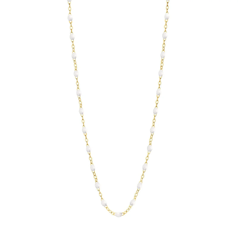The Classic Gigi 17 Necklace by Gigi Clozeau features small, hand-lacquered resin beads spaced along an 18k gold chain, shown on a plain white background. Available in multiple colors.