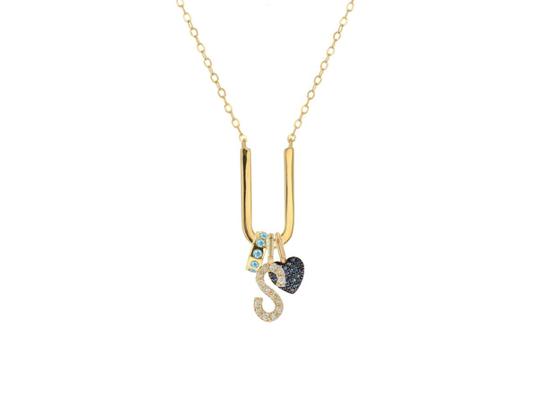 The Rachel Reid Charm Holder Necklace features a 14K gold chain with a diamond-studded letter S and a dark, gem-encrusted heart, creating an exquisite statement piece.